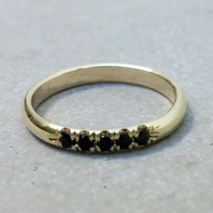 yellow gold 5 stone eternity ring with black onyx