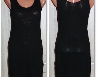 May include: A black sleeveless dress with a scoop neck. The dress is made of a soft, stretchy fabric and has a fitted silhouette.