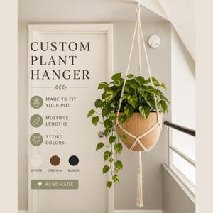 May include: A cream-colored macrame plant hanger holding a potted pothos plant with green and yellow variegated leaves. The text reads CUSTOM PLANT HANGER, MADE TO FIT YOUR POT, MULTIPLE LENGTHS, 3 CORD COLORS, WHITE, BROWN, BLACK, HANDMADE.