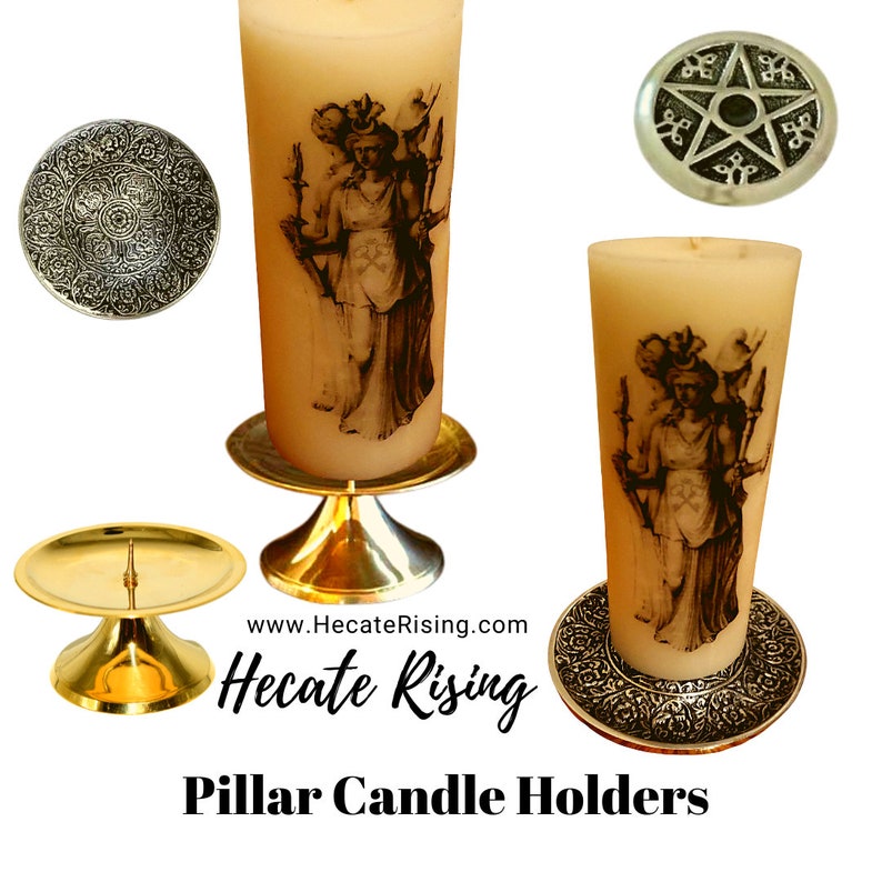 May include: Two gold pillar candle holders with a silver base and a silver top. The candle holders are decorated with a design of a woman holding torches. The text "Hecate Rising" is visible on the image.