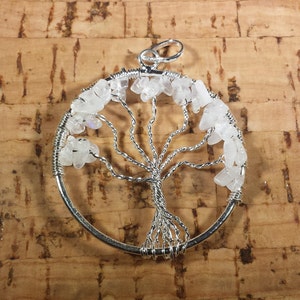 May include: Silver wire tree of life pendant with white moonstone chips.