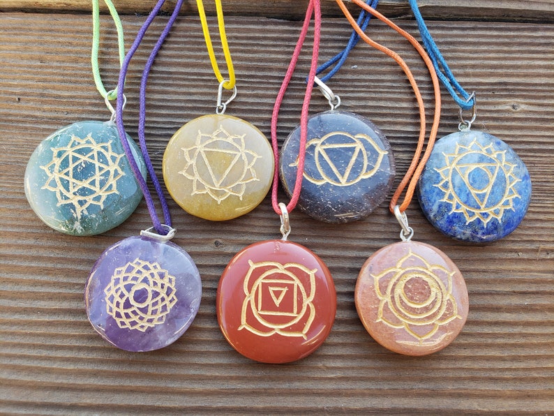 7 Chakra Gemstone Engraved Disk Pendant Set With Cords Image 0