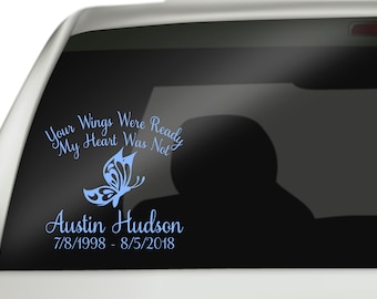 May include: A blue butterfly with a white outline and the text "Your Wings Were Ready My Heart Was Not" above it. Below the butterfly is the text "Austin Hudson 7/8/1998 - 8/5/2018".