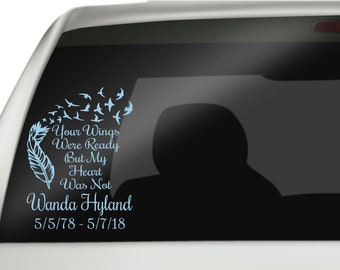 May include: A blue and white car window decal with a feather and flying birds. The text reads "Your Wings Were Ready But My Heart Was Not Wanda Hyland 5/5/78 - 5/7/18".