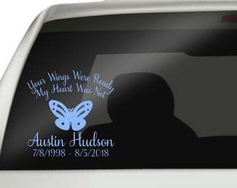 May include: A light blue car decal with the text "Your Wings Were Ready, My Heart Was Not" above a butterfly graphic. Below the butterfly is the name "Austin Hudson" and dates 7/8/1998 - 8/5/2018.