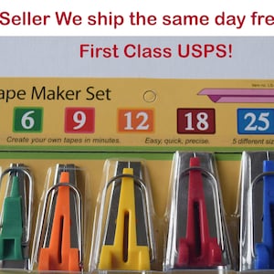May include: A set of five tape maker tools in a clear plastic package. The tools are silver with different colored plastic handles: green, orange, yellow, red, and blue. The package has a yellow background with the text "Tape Maker Set" and numbers 6, 9, 12, 18, and 25.