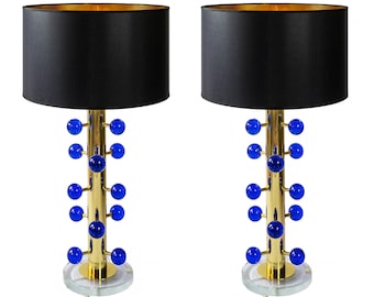 Par de lámparas de mesa italianas en latón y cristal de Murano azul.