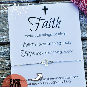 May include: A white card with the words "Faith makes all things possible, Love makes all things easy, Hope makes all things work" printed on it. A silver chain bracelet with a small silver cross charm is on top of the card. The card also says "Wear this as a reminder that faith will see you through anything. Let your Faith be bigger than your fears!"