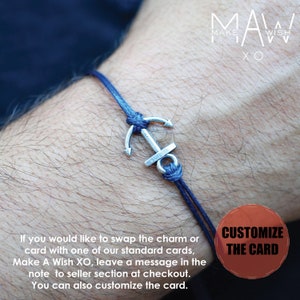 May include: A blue cord bracelet with a silver anchor charm. The bracelet is on a person's wrist. The text "MAW MAKE A WISH XO" is in the upper right corner of the image. The text "CUSTOMIZE THE CARD" is in a red circle in the lower right corner of the image.