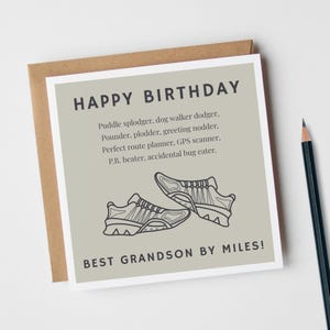 May include: A birthday card with the text "HAPPY BIRTHDAY" in dark gray. Below, a list of humorous descriptions and a drawing of two sneakers. The phrase "BEST GRANDSON BY MILES!" is at the bottom. The card is in a brown envelope.