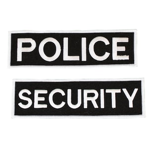May include: Two black fabric patches with white embroidered text. The top patch reads "POLICE" and the bottom patch reads "SECURITY".