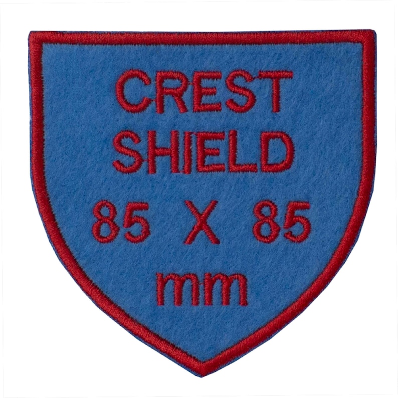 May include: Blue felt crest shield patch with red embroidered text that reads "CREST SHIELD 85 X 85 mm".