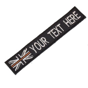 May include: Black embroidered patch with a white Union Jack design and the text "YOUR TEXT HERE" in white.
