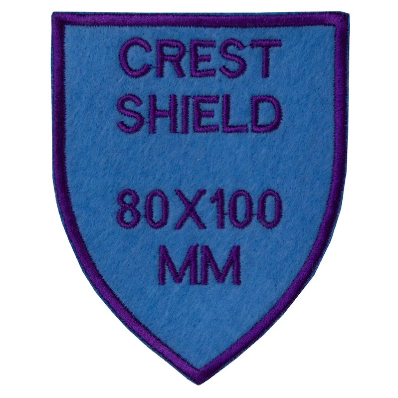 May include: A blue felt crest shield patch with purple embroidered edging. The patch reads "Crest Shield" and "80 x 100 MM".