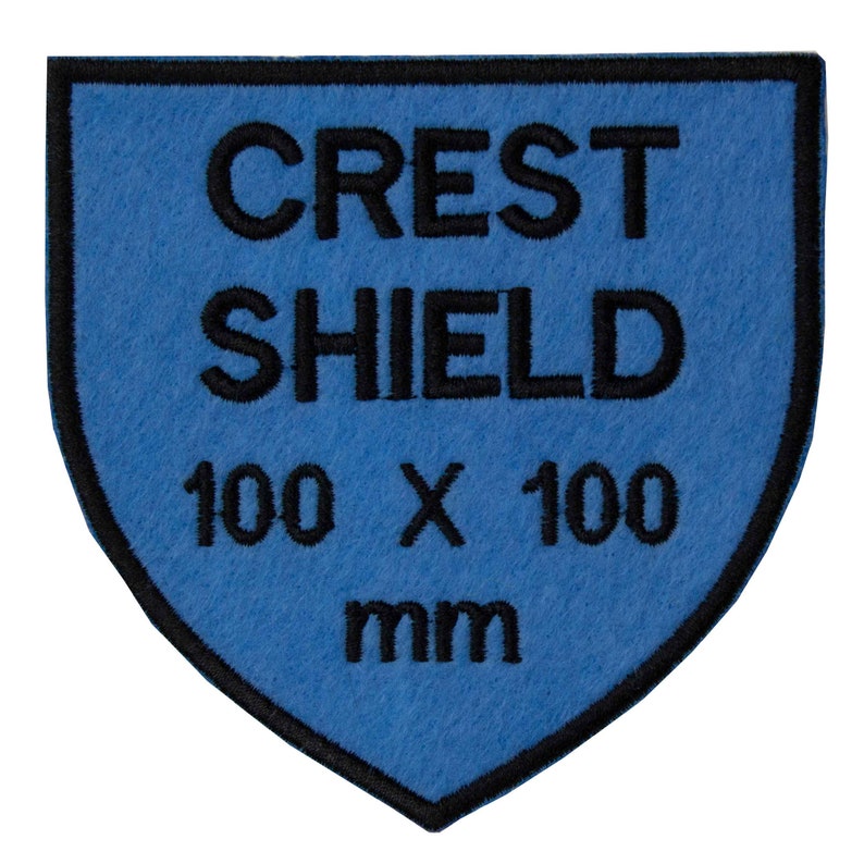May include: Blue felt shield patch with black embroidered text that reads "CREST SHIELD 100 x 100 mm".