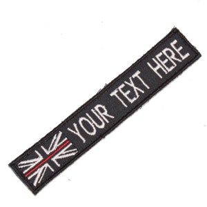 May include: Black fabric patch with a white embroidered Union Jack flag and the text "YOUR TEXT HERE" in white.
