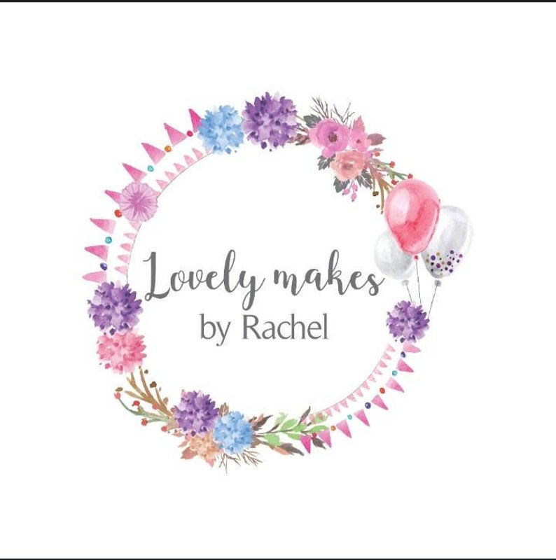 May include: Watercolor logo design featuring a floral wreath with pink, purple, and blue flowers. The text "Lovely makes by Rachel" is written in a script font, with pink and white balloons on the right side.