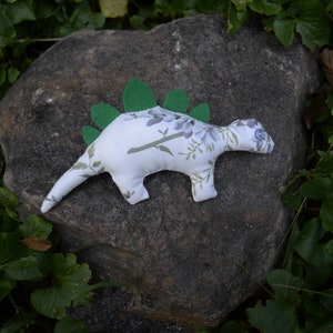 Flowery Steggysaurus: white fluffy dinosaur stegosaurus toy for kids, one-for-one charitable children&#39;s stuffed animal