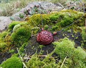 Hand Carved Labyrinth Avocado Seed Pendant
