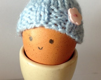 Handknit pale blue egg cosy handknitted egg cozy with flower embellishment Easter gift