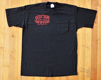 Vintage Black Ron Jon Surf Shop One of a Kind Cocoa Beach Single Stitched Pocket Tee size Large on Jerzees made in USA
