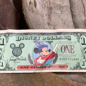 1997 A Disney Dollar Sorcerer Mickey front Cinderella Coach on back 25th Anniversary Disney World Extremely Rare image 1