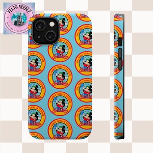 May include: A light blue phone case featuring a repeating pattern of Mickey Mouse holding a globe, with the text "I'M A WORLD SHOWCASE TRAVELER". The case also has the text "FELT & NEEDLE" and "MAGICAL GADGETS & GIFTS".