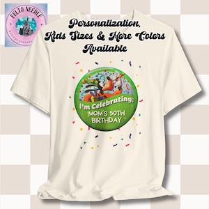 May include: White t-shirt with a green button featuring a cartoon image of Mickey Mouse and Goofy. The button says "I'm Celebrating: Mom's 50th Birthday".