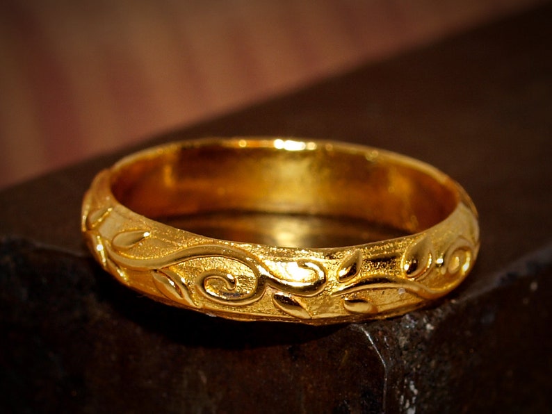 24k ring with a floral pattern.