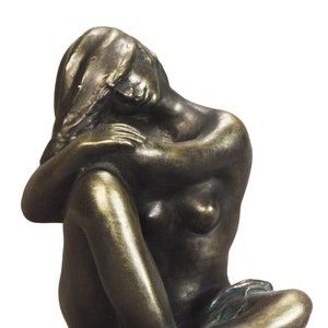 Young woman seated on floor