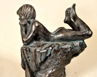 Cold cast bronze sculpture/statue, woman lying on a platform