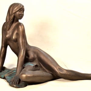 Cold cast  Bronze sculpture, woman lying on cloth