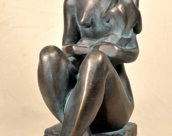 Modern statue, young woman with her son in arms