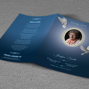 May include: A blue funeral program with a photo of a woman in a circle surrounded by white flowers. The program includes the text "The loving memory of Janifer Smith" and the dates "Date of Birth 20 May 1930" and "Date of Death 31 July 2013".