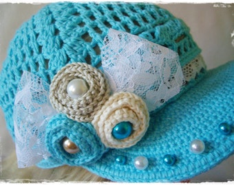 Blue crochet hat with flower and beads