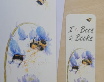 May include: Watercolor illustration of bees and bluebell flowers on a greeting card and bookmark. The bookmark reads "I ❤️ Bees & Books". The card and bookmark have a white background.
