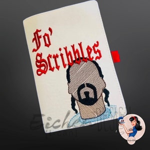 May include: White notebook with red embroidered text "Fo' Scribbles" and a black and white embroidered image of a man with a beard and long hair.
