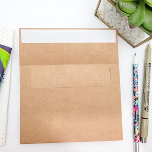 May include: A brown paper envelope with a white adhesive strip on the top flap. The envelope has a flap on the side for inserting a letter.