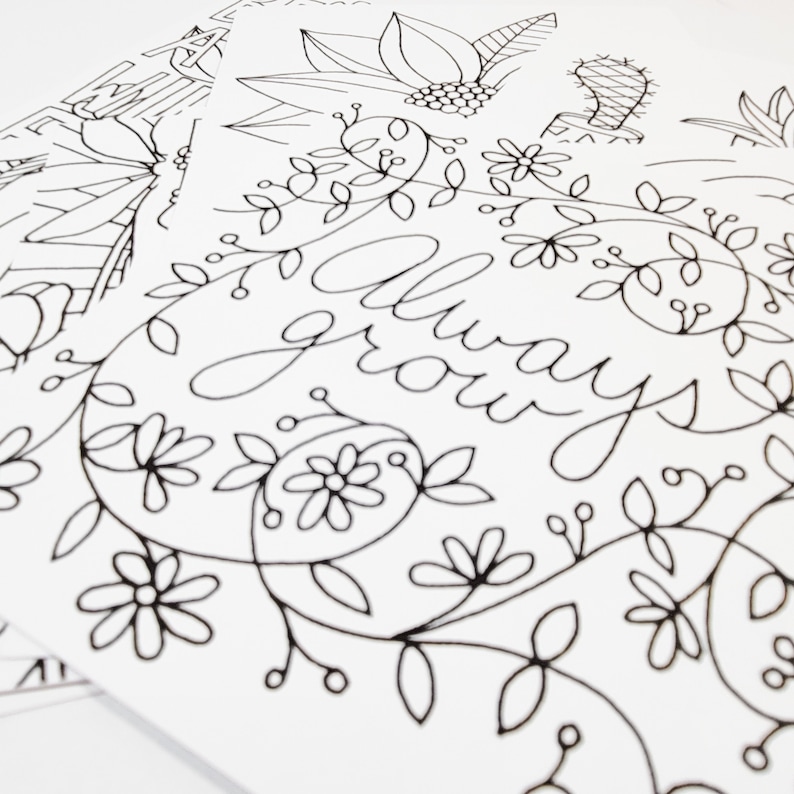 May include: Black and white line art print featuring the words "always grow" surrounded by floral designs.