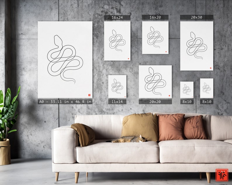 May include: White art prints with a minimalist line drawing of a snake. The prints are available in various sizes, including a large A0 size (84.1 cm x 118.9 cm). Each print has a small red square in the corner. The prints are displayed on a gray wall.