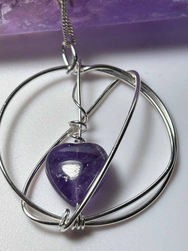 Heart shaped amethyst gemstone in silver wire wrapped pendant by Silver Wire Designs