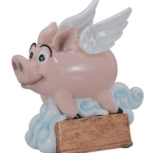May include: A pink pig with wings flying on a blue cloud with a gold base. The pig has a happy expression and is holding a blank gold plaque.
