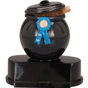 May include: Black and blue trophy shaped like a pot with a lid and a blue ribbon. The pot is on a black base.