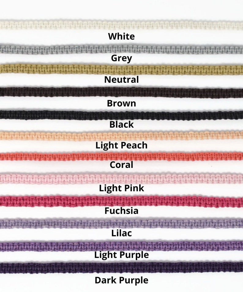May include: A close-up of a selection of colorful cords in various shades. The colors include white, grey, neutral, brown, black, light peach, coral, light pink, fuchsia, lilac, light purple, and dark purple. Each cord is labeled with its color name.