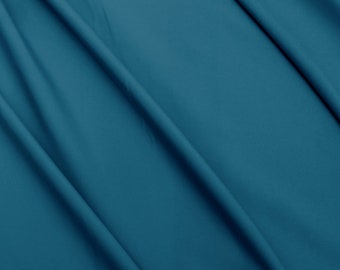 Tissu pour boardshort bleu sarcelle foncé UV 50+. Vendu par 1/2 mètre
