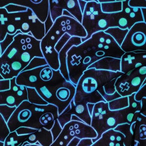 May include: A black fabric with a repeating pattern of neon blue and teal video game controllers. The controllers are outlined with a glowing effect, and the design includes buttons, joysticks, and directional pads.