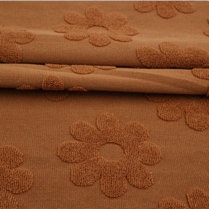 Caramel Jacquard Daisy Terry Knit. Sold by the 1/2 Yard