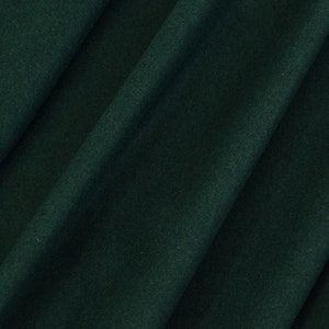 May include: Close-up of a dark green fabric with visible folds and a soft texture. The fabric has a deep, rich color, and the folds create shadows and highlights, adding depth to the material. The overall appearance suggests a high-quality textile.