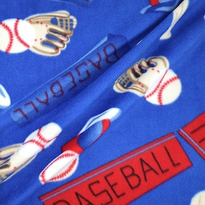 Baseballs on Blue Fleece. Sold in 1/2 Yard Increments