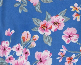 Garden Floral on Blue Double Brushed Poly. Sold in 1/2 Yard Increments